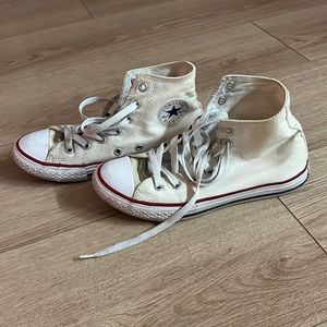 White high top Converse Chuck Taylor sneakers